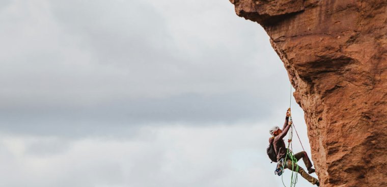 Man climbing on a cliff