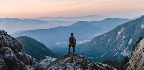 Man looking at Mountain landscape